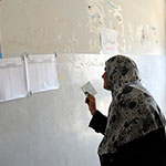 Iraq woman voeter consutling voting list