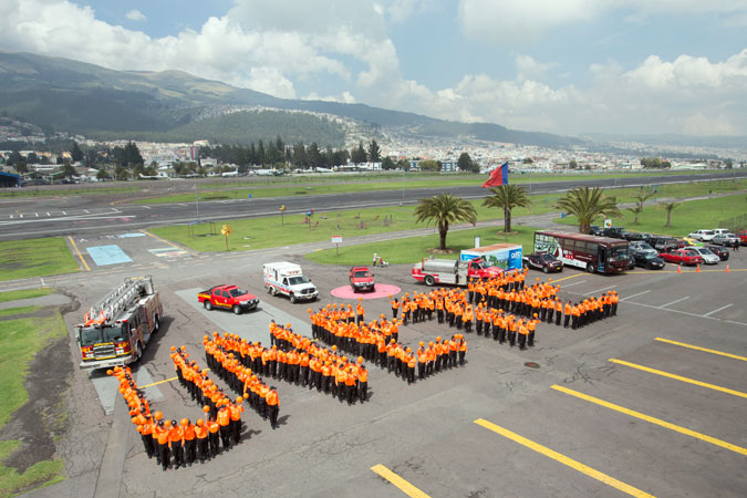 Firefighters in Quito, Ecuador, call for everyone to become part of the “Orange the world” effort to end violence against women by spelling out the word UNiTE (“Únete” in Spanish). Photo: UN Women/Martin Jamarillo