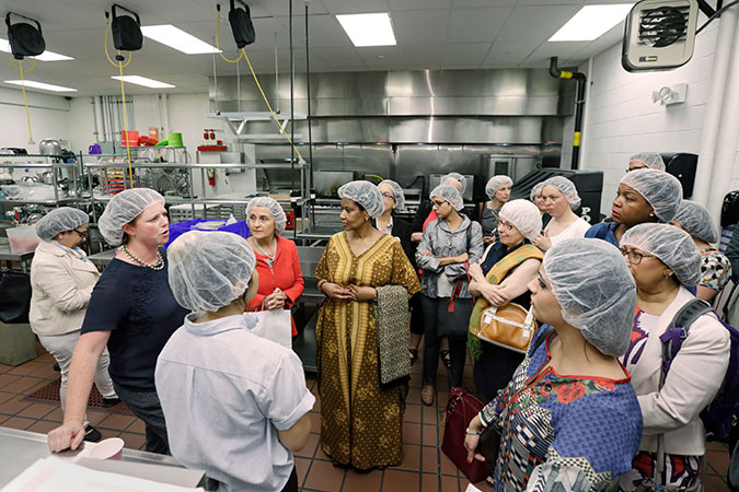Participants took a brief tour of the facilities of Hot Bread Kitchen located in La Marqueta Marketplace and supported by the City of New York. Photo: UN Women/Ryan Brown