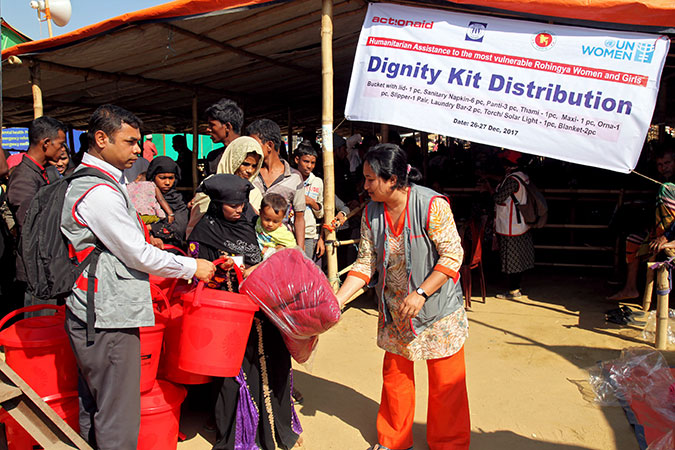 UN Women and partners distribute essential relief items such as soaps, clothes, scarves, menstrual hygiene products and flashlights to women, packaged together into what is called a “dignity kit”. Photo: ActionAid Bangladesh/Md. Sariful Islam
