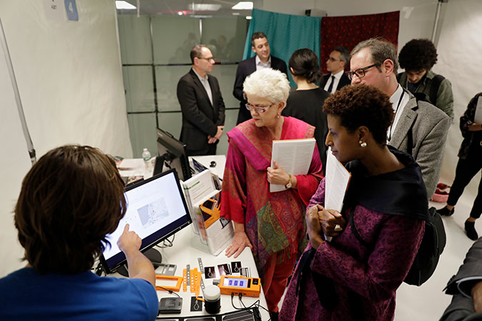 Blockchain technology solution-providers demonstrate their solutions. Photo: UN Women/Ryan Brown