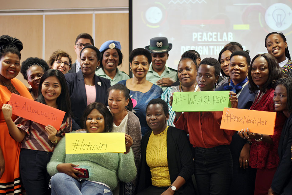 Participants in the Youth Peace Lab hold up their hashtags. Photo: UN Women/Otae Mkandawire.