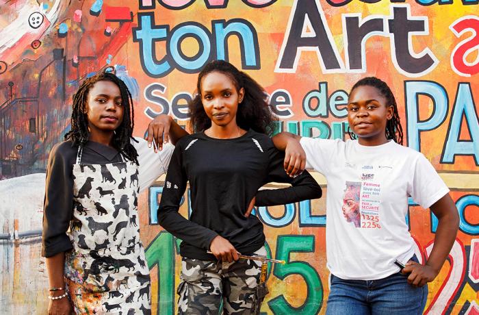 In Goma, Democratic Republic of Congo, artists (left to right) Edith Congane, Linda Bindu Rose and Esther Amisi Estam create works of art that reflect peace and tolerance as part of a UN Women-supported arts organization The Art of Peace - UJADP.