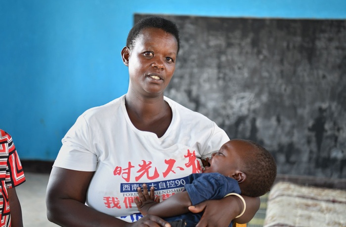 Christine Mukamana is seen with her youngest son at the Early Childhood Development Centre in Munini Sector, Rwanda.