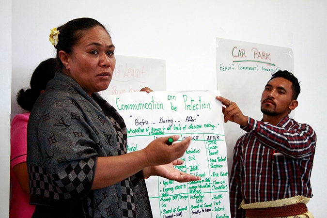 Participants at the Tonga National Gender and Protection in Humanitarian Action Training present groupwork on the importance of communication during emergencies, Tonga, 2016. Photo: UN Women/Lauretta Ah Sam
