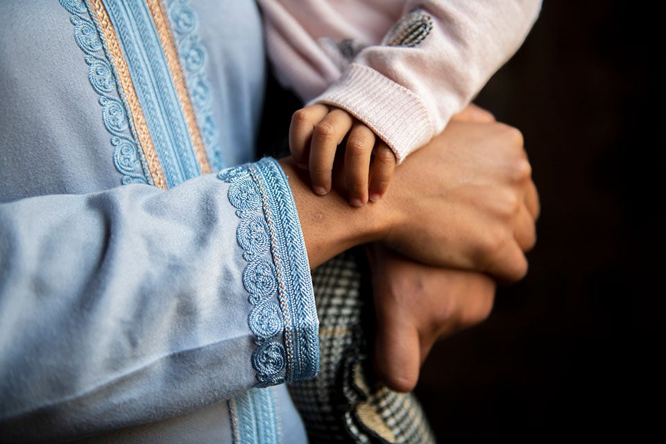 Layla Bennani holds her daughter. Photo: UN Women/Mohammed Bakir