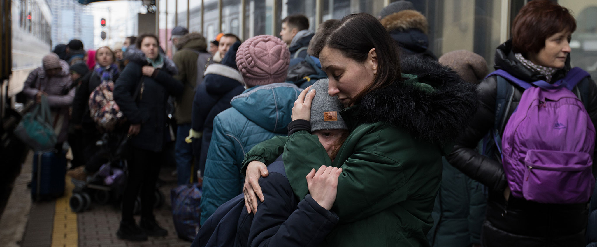 People in Kyiv, Ukraine crowd the train stations trying to get out of the country during the Russian invasion, but the evacuation trains are not enough for all the people.  1 March 2022. Photo: Sebastian Backhaus/Agentur Focus/Redux.