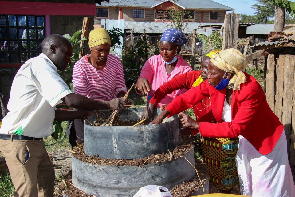 Farmers in Laikipia County constructing vertical gardens – a climate smart approach that reduces labour input, creates diversity in crops and increases water preservation. Credit: UN Women/ James Ochweri