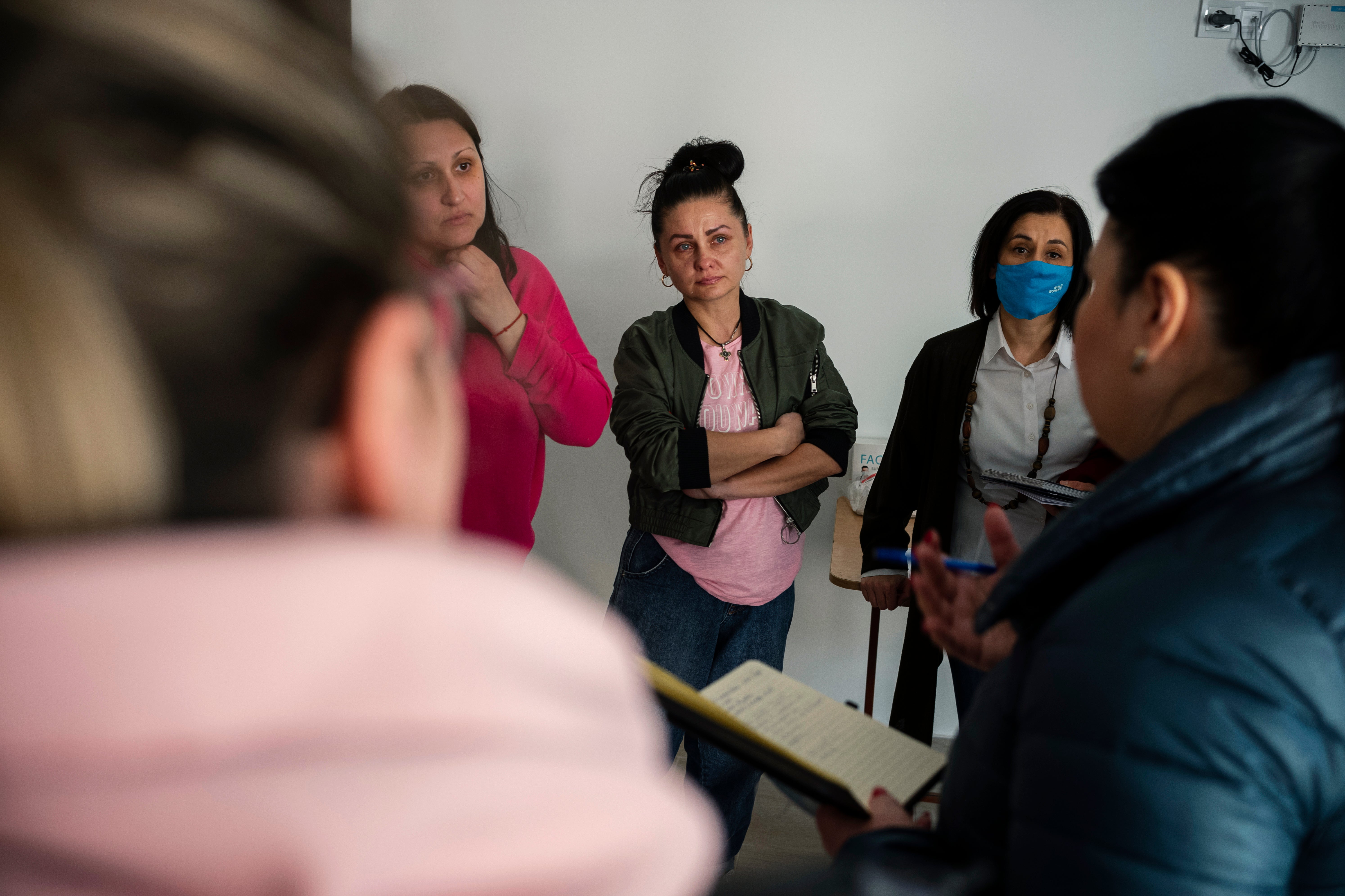 Snejana, 41, from Odessa, discussing with UN Women team at a temporary placement center in Scoreni, Straseni district, Moldova.