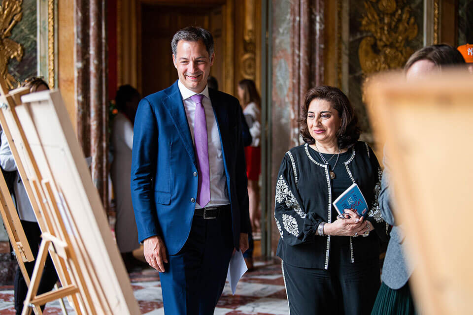 Prime Minister of Belgium Alexander De Croo and UN Women Executive Director Sima Bahous visit the “Generation Equality: Picture It” exhibition, on display at the She Decides Conference in Brussels, Belgium, on 19 May 2022. Photo: Belgium Foreign Affairs, Foreign Trade and Development Cooperation.