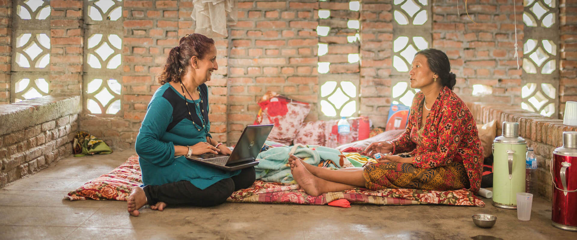 Sujata Sharma Poudel, a psychosocial counsellor, speaks with a local woman at the Women's Rehabilitation Centre in Panchkhal Nepal. Following the 2015 earthquake, Ashmita Tamang, district psychosocial counsellor with Nepal-based Centre for Victims of Torture reiterated that the number of domestic and sexual violence cases she dealt with increased. Photo: UN Women/Samir Jung Thapa.