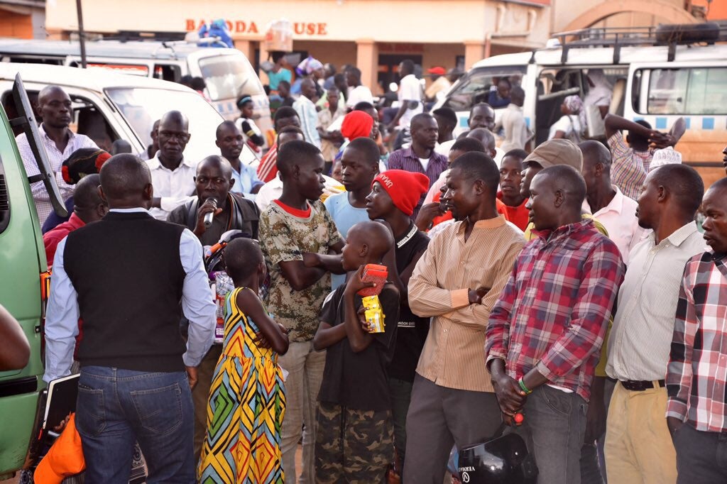 Engaging male vendors on ending violence against women and girls in Uganda. Photo: UN Women/Eva Sibanda