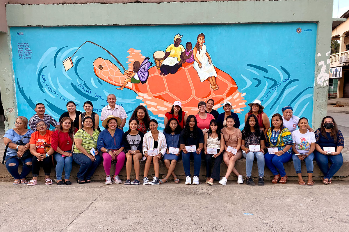 In the city of Tela, Honduras, seven female students of the Francisco Morazán Basic Education Centre helped create a mural for the 16 Days, which represents the strength, freedom and ancestral knowledge of indigenous people and how women and girls can change the world. Photo: UN Women/Luis Hércules