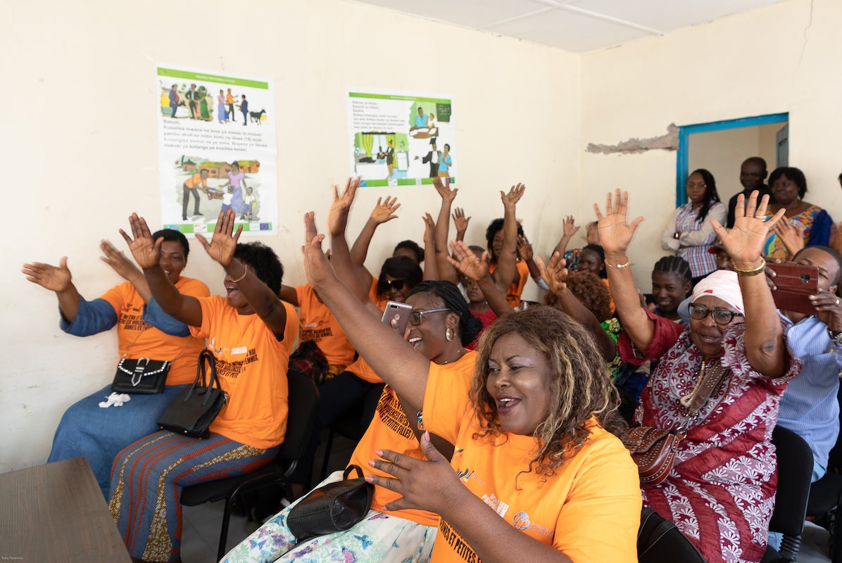 Twenty women vendors from the Mont Mgafula market celebrate receiving their business registration certificates at a ceremony at Mont Ngafula Town Hall on 6 October 2022. Photo: UN Women/Yulia Panevina 