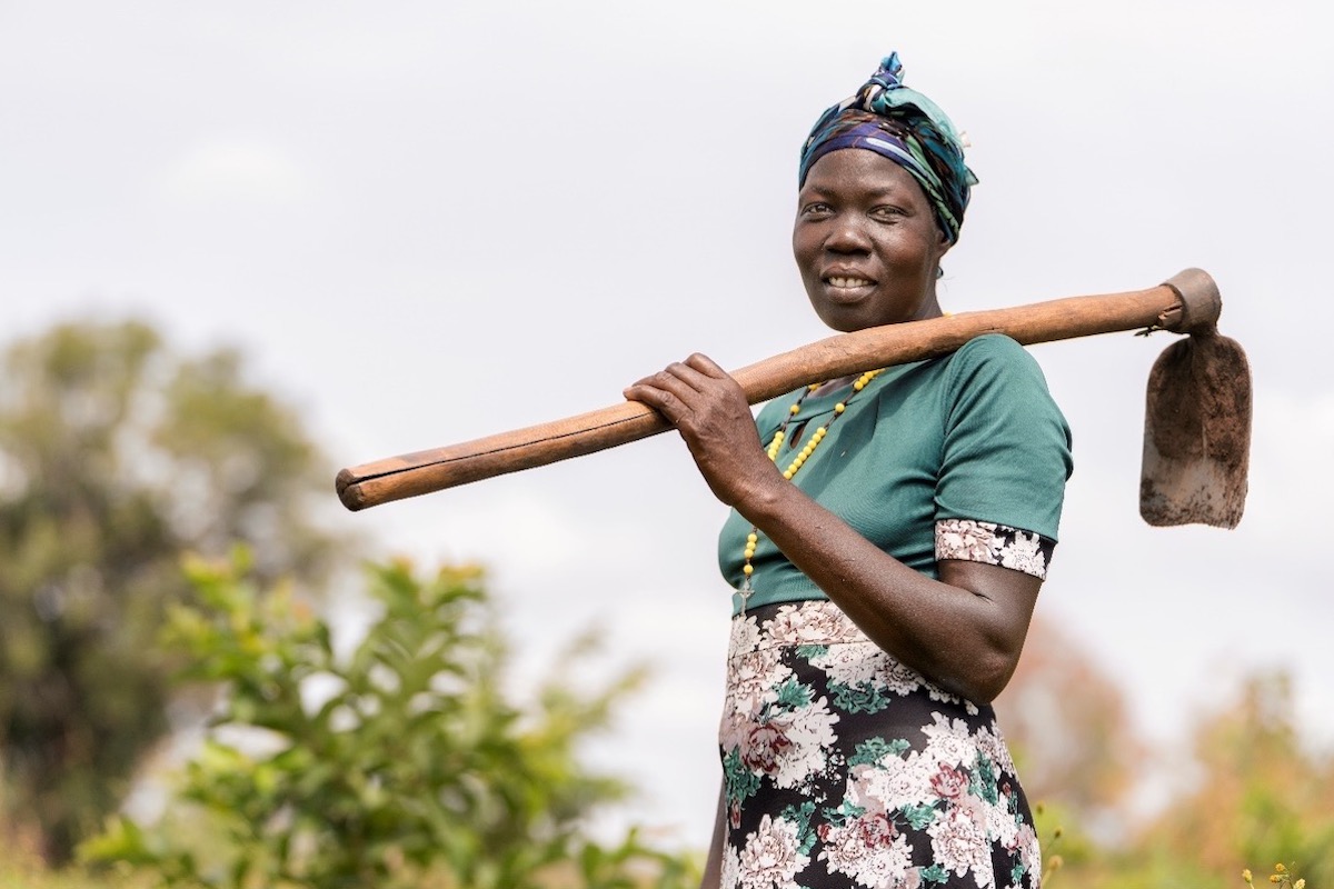 Florence Driciru, a farmer and a mother of five, has improved her crop yield using climate smart agriculture. Photo: UN Women/Jeroen van Loon