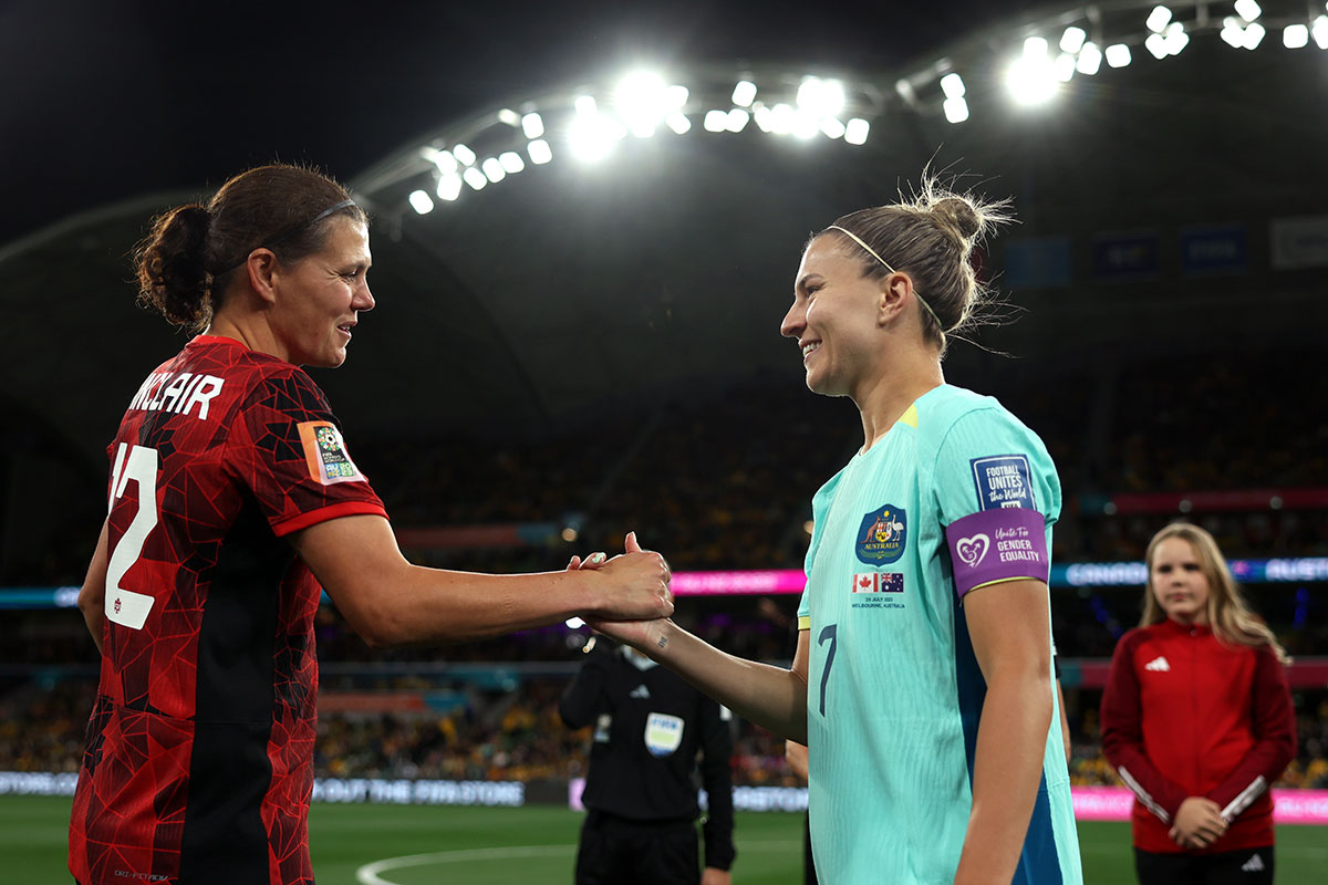 Steph Catley (right) of Australia shakes hands with Christine Sinclair of Canada before the coin toss prior to kick-off during the FIFA Women’s World Cup 2023 Group B match between Canada and Australia on 31 July 2023 in Melbourne/Naarm, Australia. Photo: FIFA/Alex Pantling.