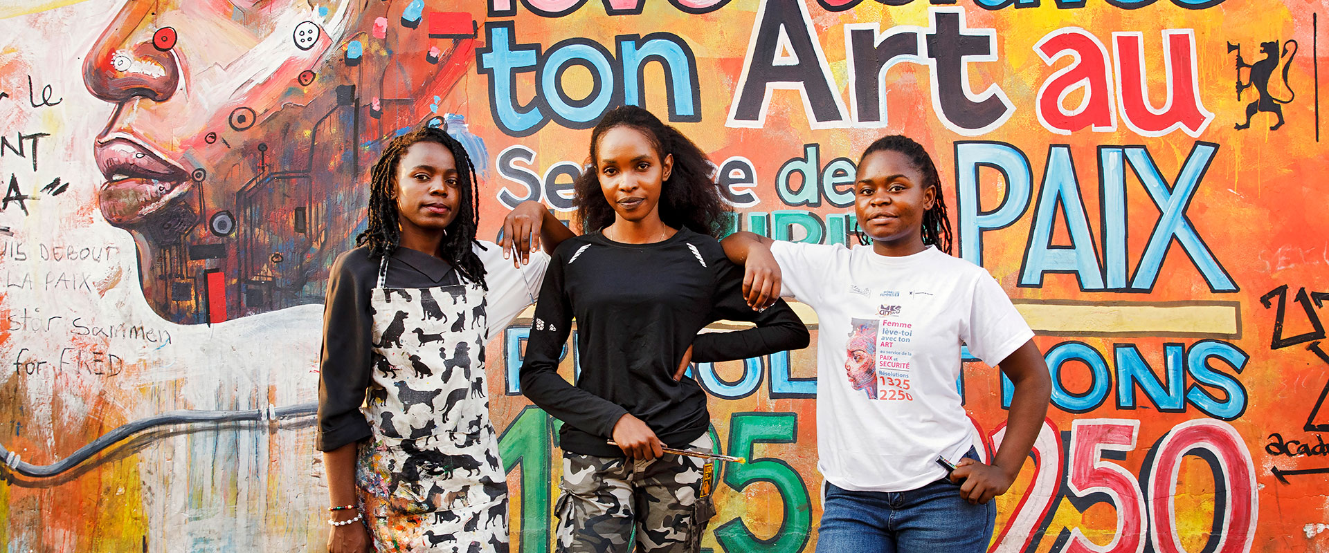 In Goma, Democratic Republic of Congo, artists (left to right) Edith Congane, Linda Bindu Rose and Esther Amisi Estam create works of art that reflect peace and tolerance as part of a UN Women-supported arts organization The Art of Peace - UJADP.