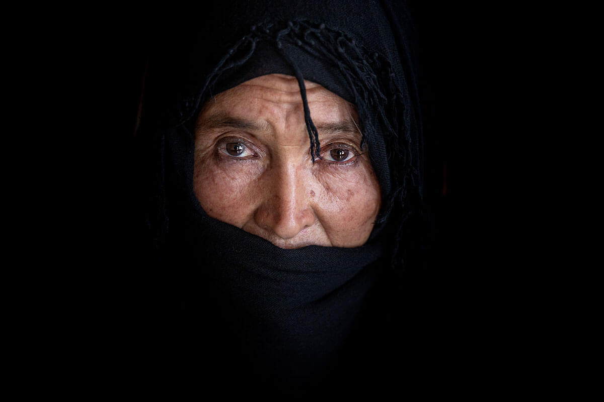 A 51-year-old Afghan woman who lost her husband in a suicide attack. She has no other family members and now lives with a neighbour. Photo: UN Women/Sayed Habib Bidell.