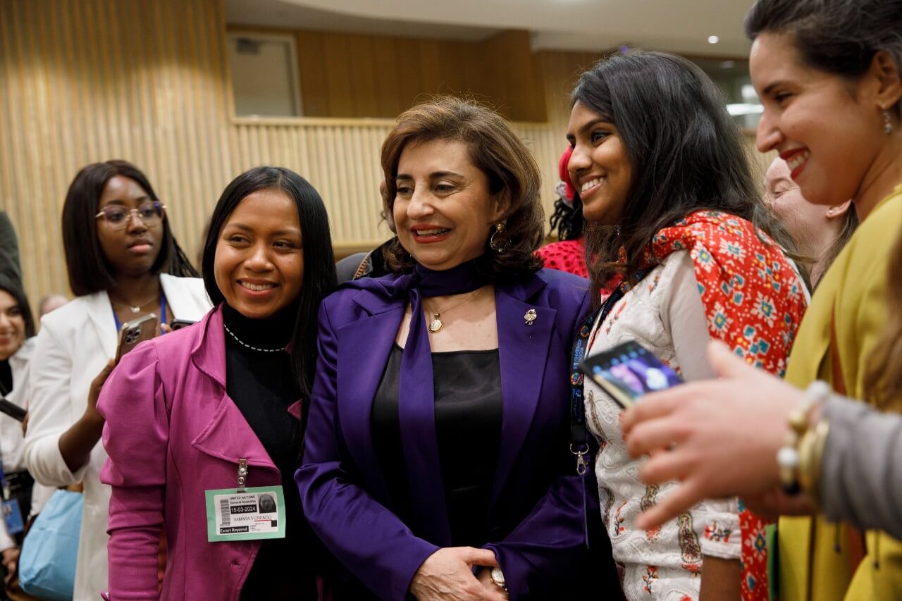 UN Women Executive Director Sima Bahous shares a moment with participants in the Youth Forum opening on 15 March 2024 in UN headquarters. Photo: UN Women/Ryan Brown.
