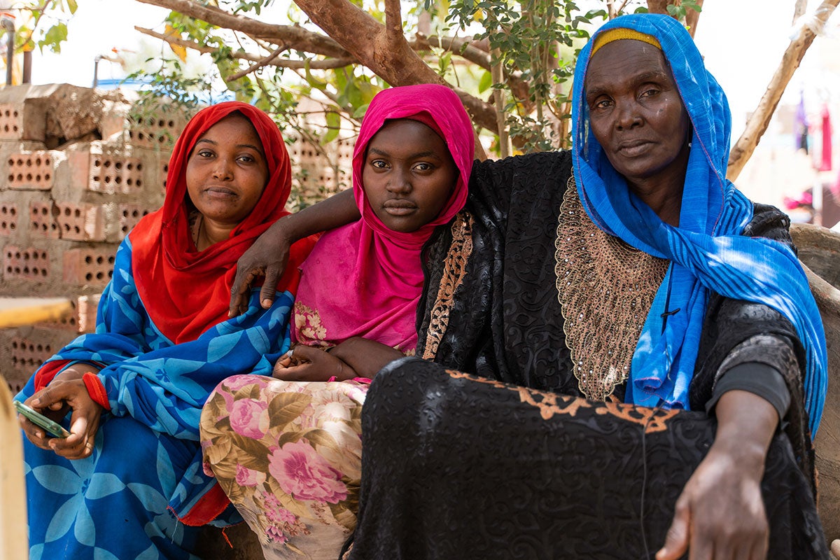 Aziza Ibrahim (right) is seen with with her daughters Amal (middle) and Eman (left).