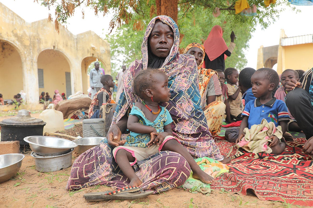 Mariam Djimé Adam, a refugee from Sudan with eight children, is seen in the yard of a secondary school in the neighbouring country of Chad..