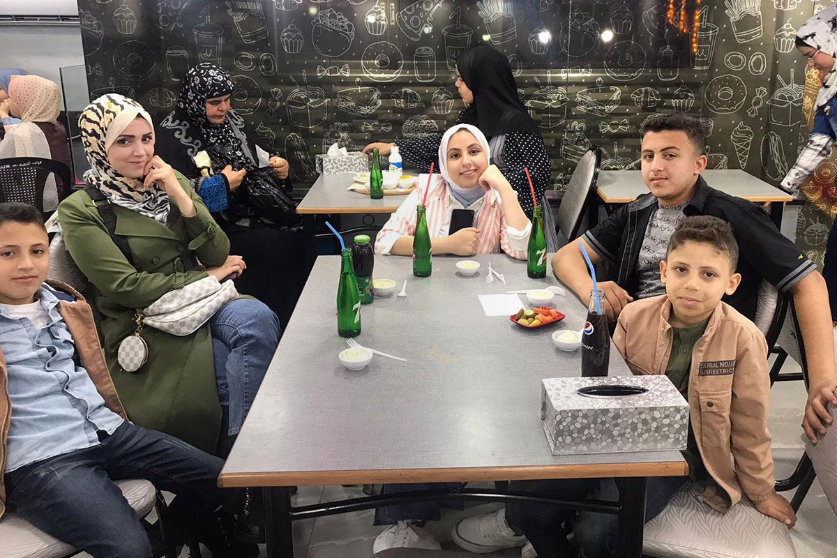 Amani Al Derbi is seen with her children.