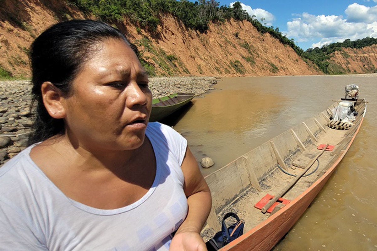 Miriam Pariamo lives the San José de Uchupiamona community, located inside Madidi National Park, which is currently affected by mining activity. She is photographed by the Tuichi river.