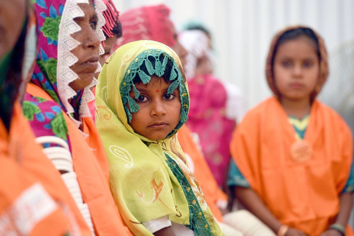 A child looks at the camera during a UN Women event in Pakistan
