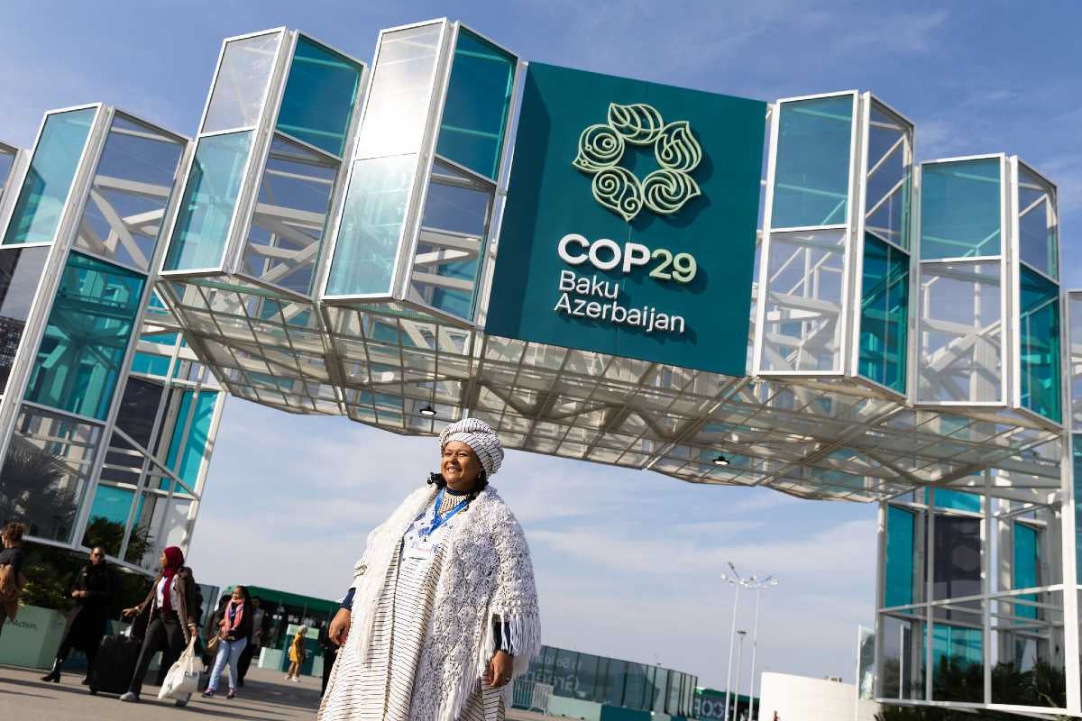 A COP29 attendee stands outside the venue in Baku, Azerbaijan. Photo: UN Climate Change/Kiara Worth.