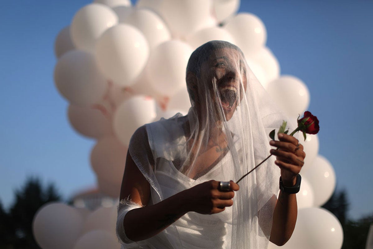 A civil society activist outside of the parliament building in Beirut celebrates the abolishment of article 522 from the Lebanese Penal Code on 17 August 2017.  On the heels of Jordan and Tunisia scrapping discriminatory rape laws, the Lebanese Parliament agreed on 16 August, to abolish the Penal Code Article 522, the infamous “rape law” or “rape-marriage” law, which exempted a rapist from punishment if he married his victim. Photo Courtesy of ABAAD