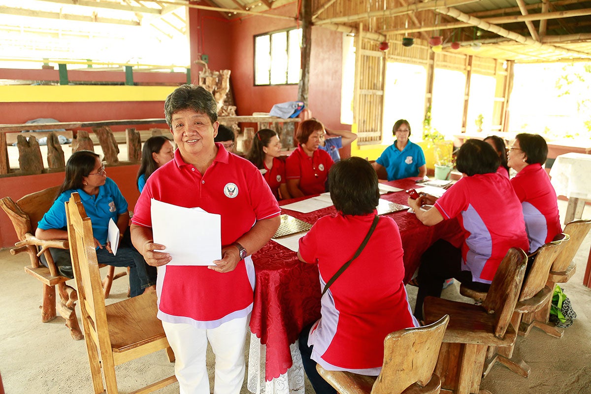 Edna Valdez, President of Bannuar TI La Union, an organization that advocates for and supports women migrant workers, is seen in 2016 in La Union province, Philippines.