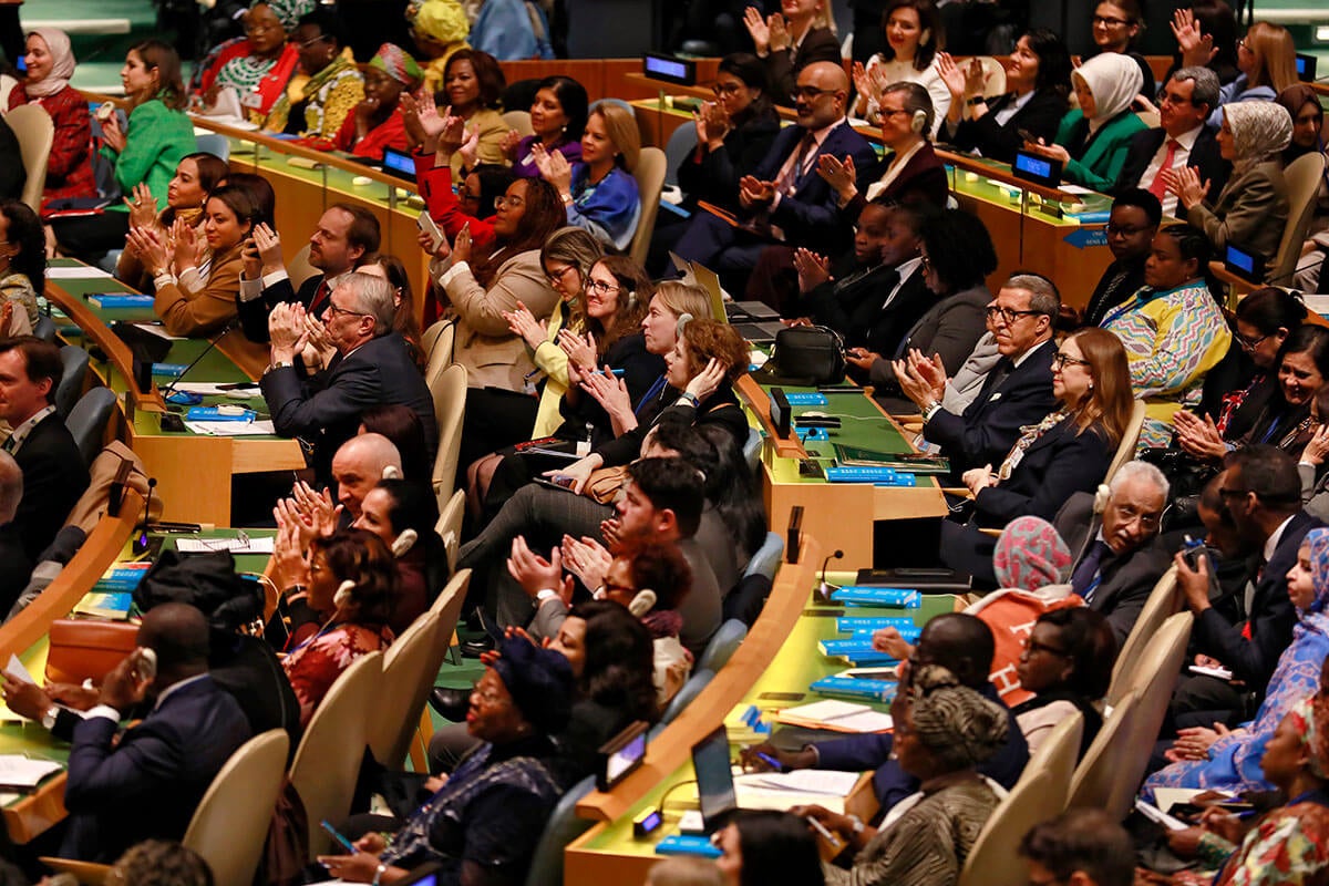 Representatives of UN Member States celebrate the adoption of the resolution titled “Political Declaration on the occasion of thirtieth anniversary of the Fourth World Conference on Women” during the opening of the sixty-ninth session of the Commission on the Status of Women, 10 March 2025, UN headquarters. Photo: UN Women/Ryan Brown.