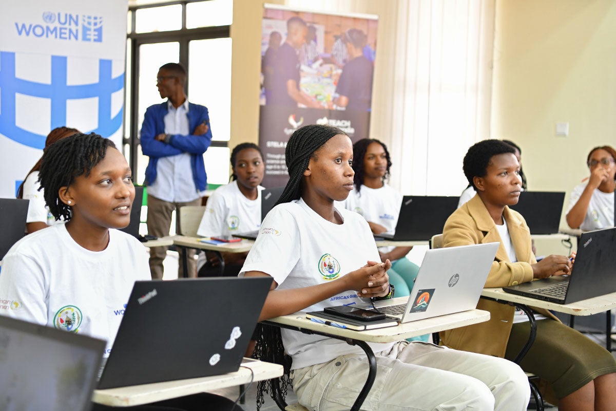 Pendo Vestine (center) participates in a session of the African Girls Can Code bootcamp. Photo: UN Women