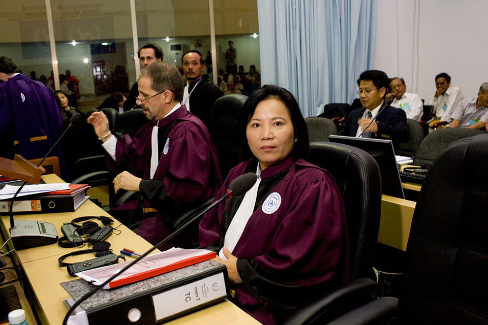 CAMBODIA. Phnom Penh. 2009. Chea Leang and Robert Petit, co-prosecutors, at the opening of the Extraordinary Chambers in the Courts of Cambodia. The ECCC is a mixed court set up under a 2003 agreement signed by the UN and the Government that addresses charges of genocide and crimes against humanity committed during the Khmer Rouge regime in the late 1970s. The hybrid tribunal includes the participation of civil parties, female national prosecutors and addresses sexual and gender violence. With the help of UN Women, the ECCC encourages survivors of sexual violence during the Khmer regime to speak out. Including women’s voices and experiences of conflict is essential to peacebuilding and transformative justice. Transformative justice seeks to address not just the consequences of violations committed during conflict but the social relationships that enabled these violations in the first place, and this includes the correction of unequal gendered power relations in society.  ©John Vink/Magnum Photos