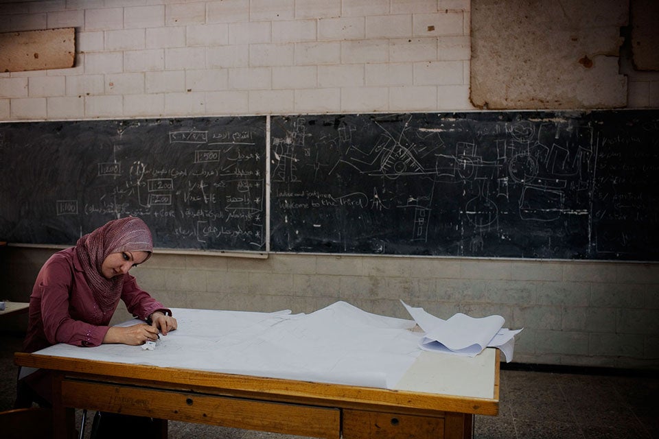 IRAQ. Baghdad. 2008. A woman works at Baghdad’s co-ed College of Engineering. Conflict is a major obstacle to women and girls’ education, and girls’ enrollment in schools often drops in times of war. As noted in the Global Study on 1325, conflict widens the gender gap in school enrollment and retention, and in literacy. Conflict-affected countries typically divert resources away from education, and heightened insecurity keeps girls in particular away from the classroom. When girls’ education is interrupted, they may be forced into early marriage, which also puts them at risk for abuse and sexual violence.  ©Jerome Sessini/Magnum Photos