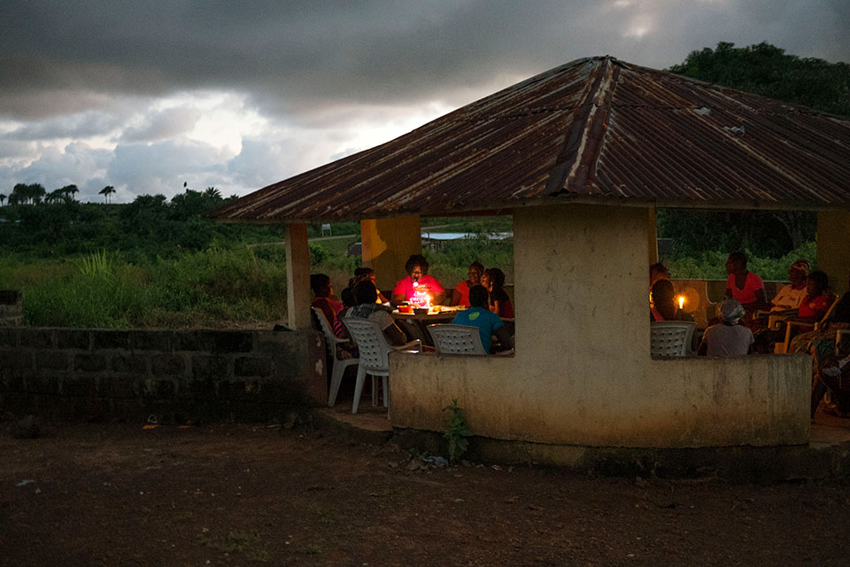 Women gather in a “Peace Hut” in Margibi County. Photo: Thomas Dworzak/Magnum Photos for UN Women