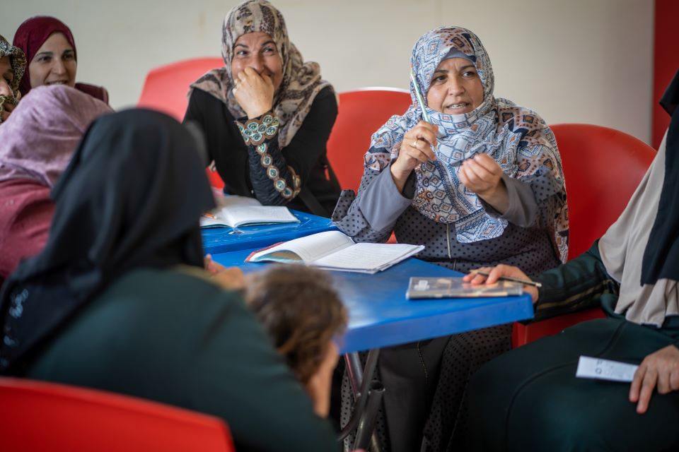 Students engage in literacy and education sessions provided at the UN Women Oasis in Za’atari refugee camp. Photo: UN Women/Christopher Herwig