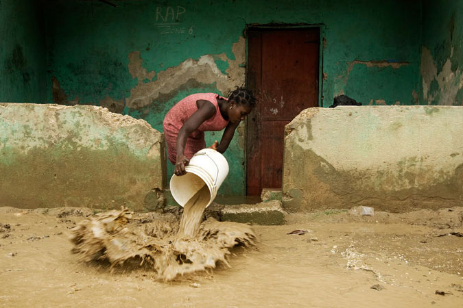 A woman cleans up her home in Cite Soleil. Hurricane Gustav passed through Haiti yesterday dumping heavy rains that flooded thousands of homes and left approximately 50 people dead. Photo: UN Photo/Marco Dormino