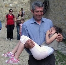 Unal Kurtal, one of the fathers participating at ACEV's training, with his youngest daughter during a trip organized by the participants of his father's support group in Turkey in 2012. Photo: Mother Child Foundation (ACEV). 
