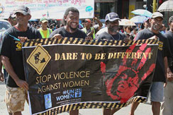Fiji men holding banner