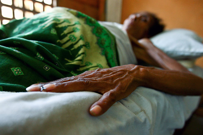 Out of focus woman in AIDS hospital. Photo: UN Photo/Martine Perret
