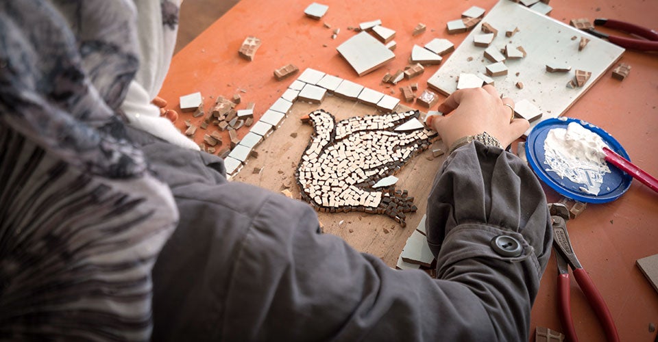 A woman crafts in the Zaatari Refugee Camp in Jordan. Photo: Christopher Herwig