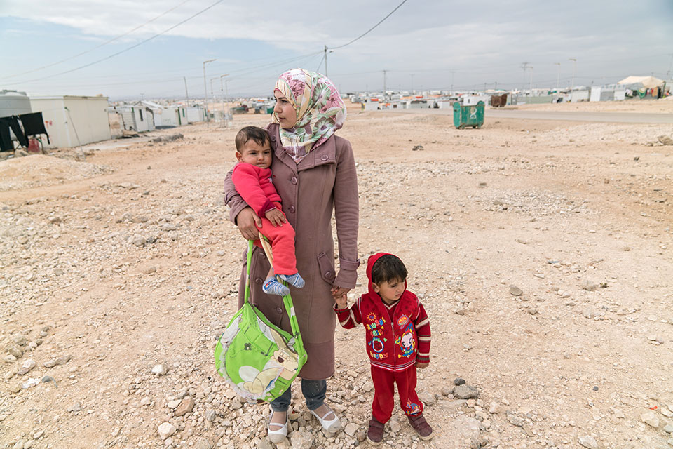 A woman refugee with her children in the Zaatari Refugee Camp in Jordan. Photo: UN Women