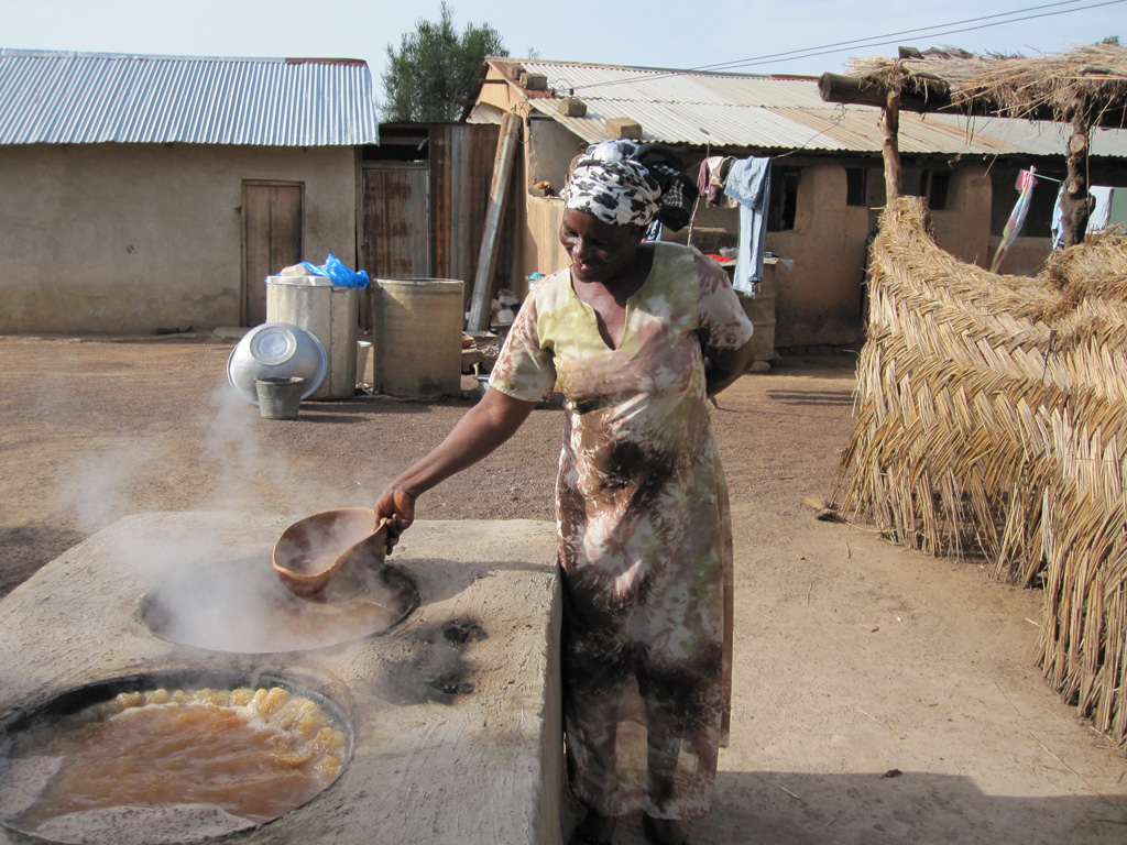 Woman using improved cookstove