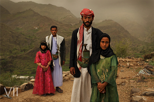 Tahani, 8, is seen with her husband Majed, 27, and her former classmate Ghada, 8, and her husband, outside their home in Hajjah, Yemen, 26 July, 2010. Photo Credit: © Stephanie Sinclair/VII/Tooyoungtowed.org