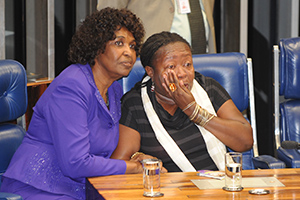 Congresswoman Benedita da Silva (left), author of the Constitutional amendment that expands rights for domestic workers, comforts Creuza Maria de Oliveira (right), President of the National Federation of Domestic Workers in Brazil, as the reform was enacted by Congress on 2 April 2013. Photo credit: Agência Brasil/José Cruz