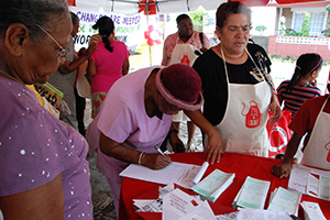 Women sign a petition urging the Government of Trinidad & Tobago to ratify ILO Convention 189 at the headquarters of the National Union of Domestic Employees in 2011. Photo credit: UN Women/Sharon Carter-Burke