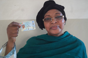 Traoré Nana Sissako, president of the women’s oversight platform for Mali's elections, displays her National Identification Number voter card.