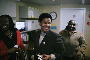 UN Women Executive Director Phumzile Mlambo-Ngcuka (centre) after saying goodbye to one of the beneficiaries of Safe Horizon's Lang House shelter, during a tour in NYC on 6 December 2013