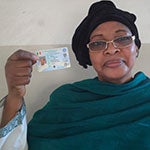 Malian woman holding id